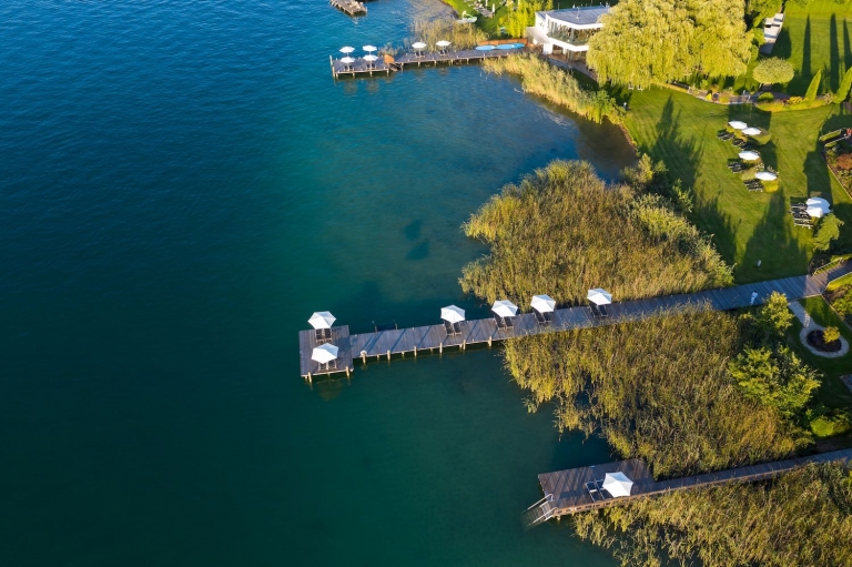 Drone shot from the shore of the Lake Wörthersee with the private VIVAMAYR dock